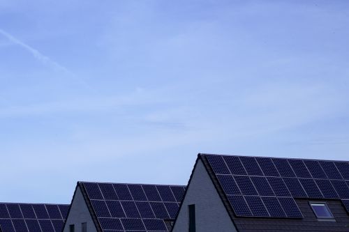 Homes with solar panels installed on pitched roofs